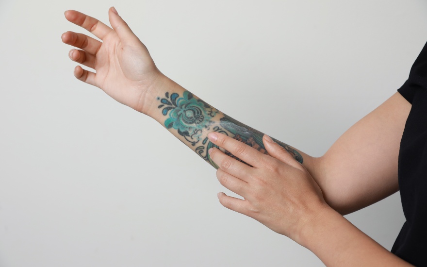 girl applying a thin layer of tattoo cream